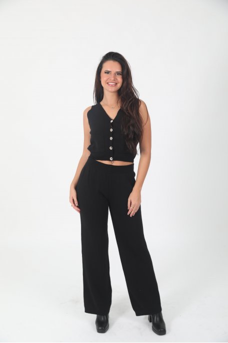 Black ensemble with buttoned vest and straight pants